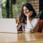 young-beautiful-business-woman-working-computer-cafe-1-1024x683